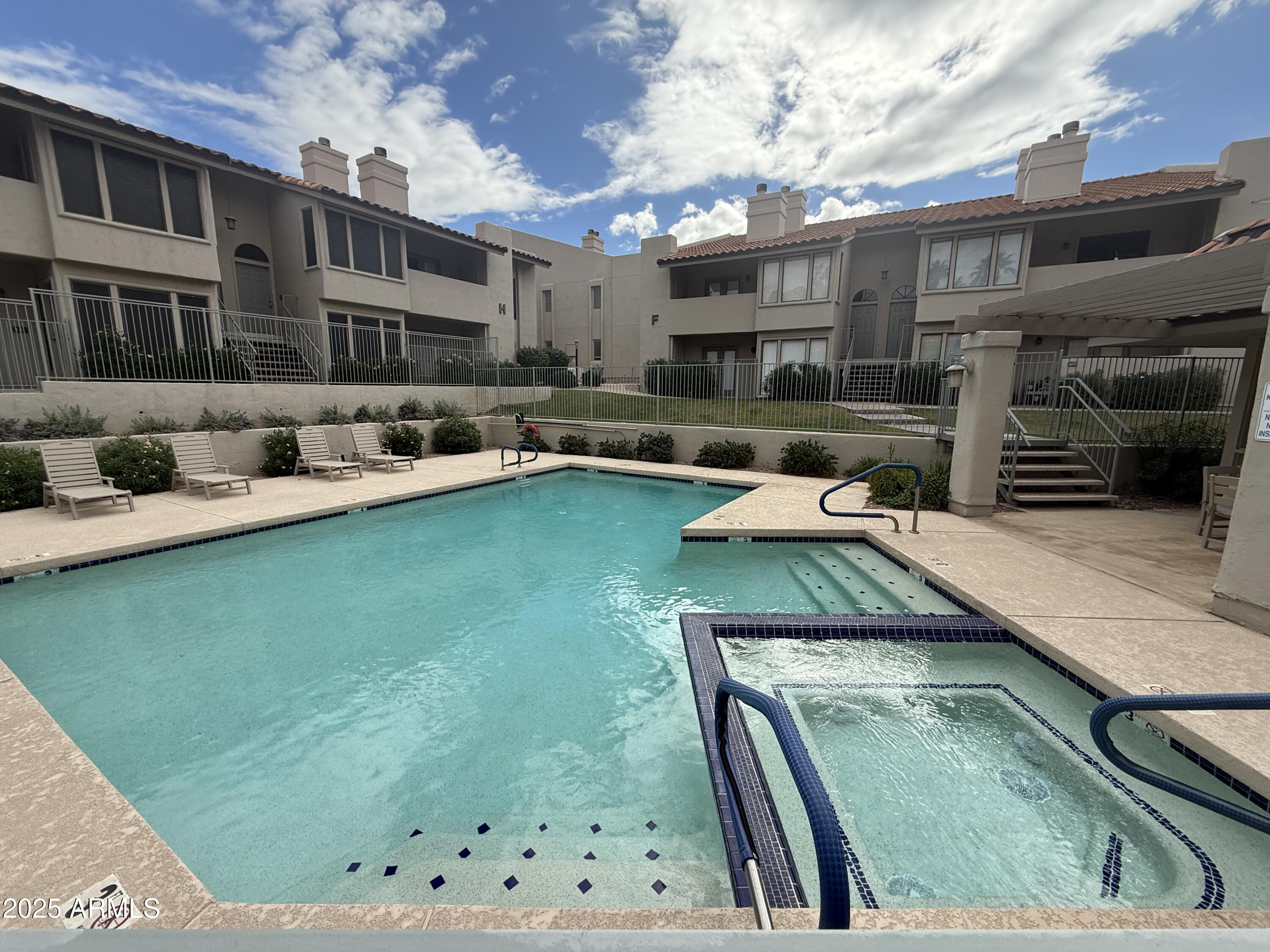 1820 East Morten Avenue, Unit 125 Phoenix, AZ 85020 - Photo 3 of 21 a view of a backyard with furniture and a swimming pool