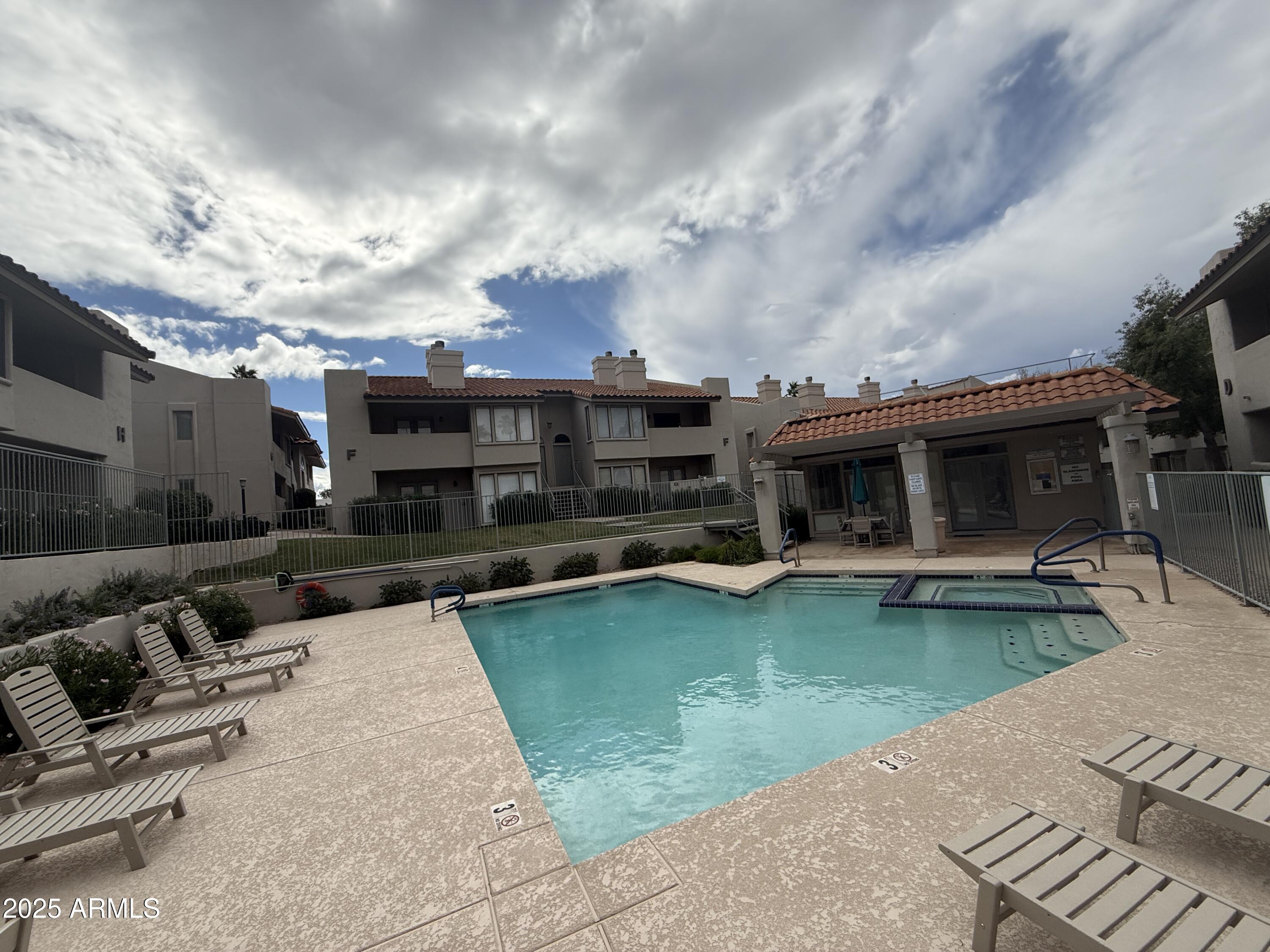 1820 East Morten Avenue, Unit 125 Phoenix, AZ 85020 - Photo 4 of 21 a view of a house with swimming pool and furniture