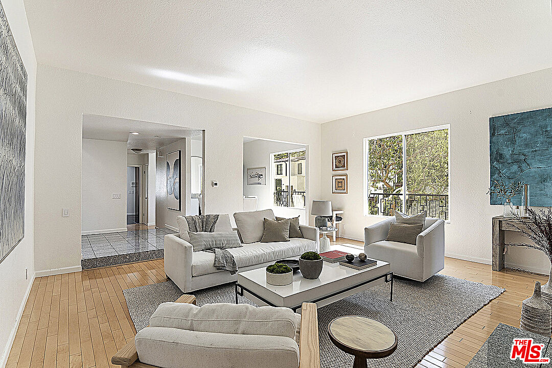 2041 Roscomare Road Los Angeles, CA 90077 - Photo 1 of 28 a living room with furniture and a large window