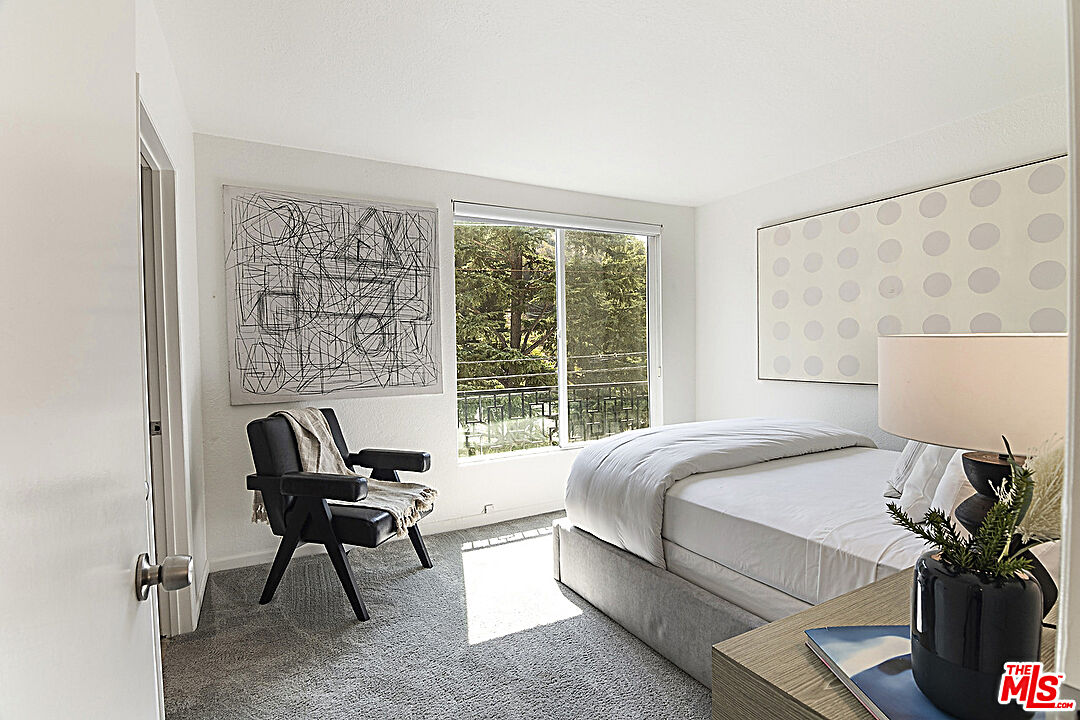 2041 Roscomare Road Los Angeles, CA 90077 - Photo 11 of 28 a bedroom with a bed and a couch