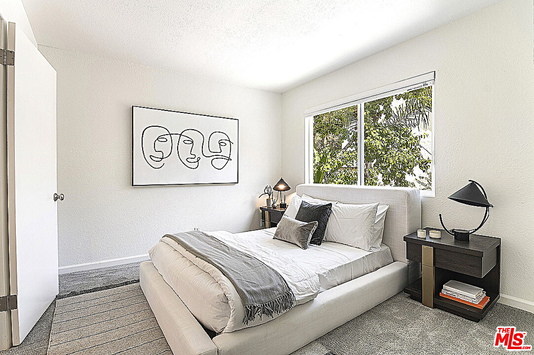 2041 Roscomare Road Los Angeles, CA 90077 - Photo 13 of 28 a bedroom with a bed and a window