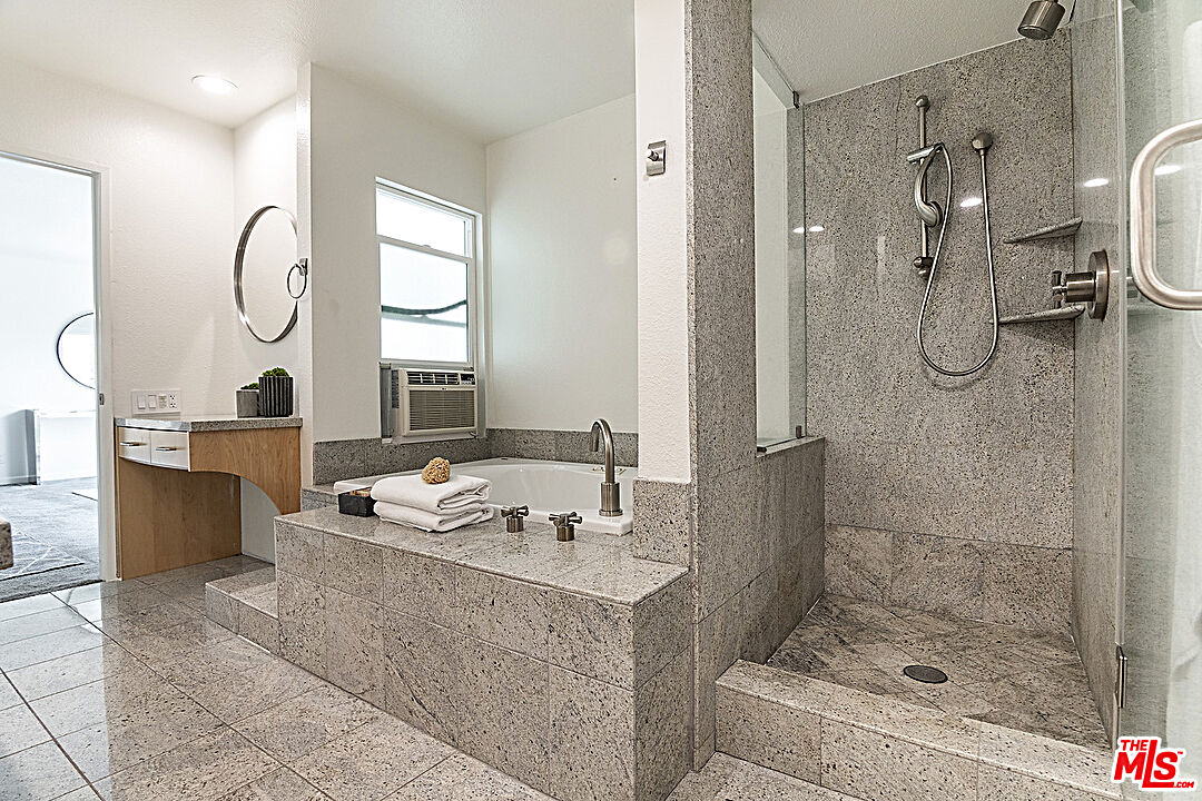 2041 Roscomare Road Los Angeles, CA 90077 - Photo 18 of 28 a bathroom with a granite countertop sink mirror and shower