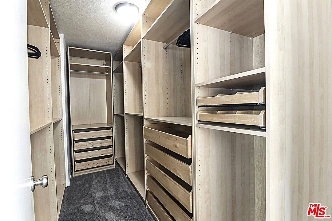 2041 Roscomare Road Los Angeles, CA 90077 - Photo 19 of 28 a view of walk in closet