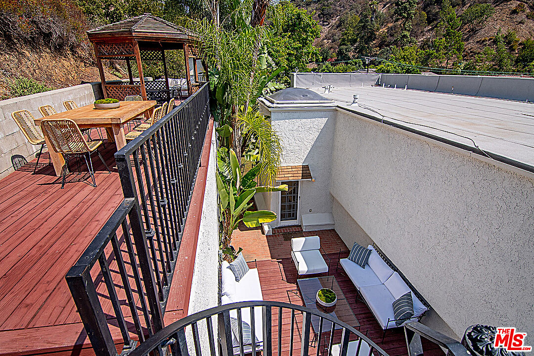 2041 Roscomare Road Los Angeles, CA 90077 - Photo 25 of 28 a terrace with outdoor seating and city view