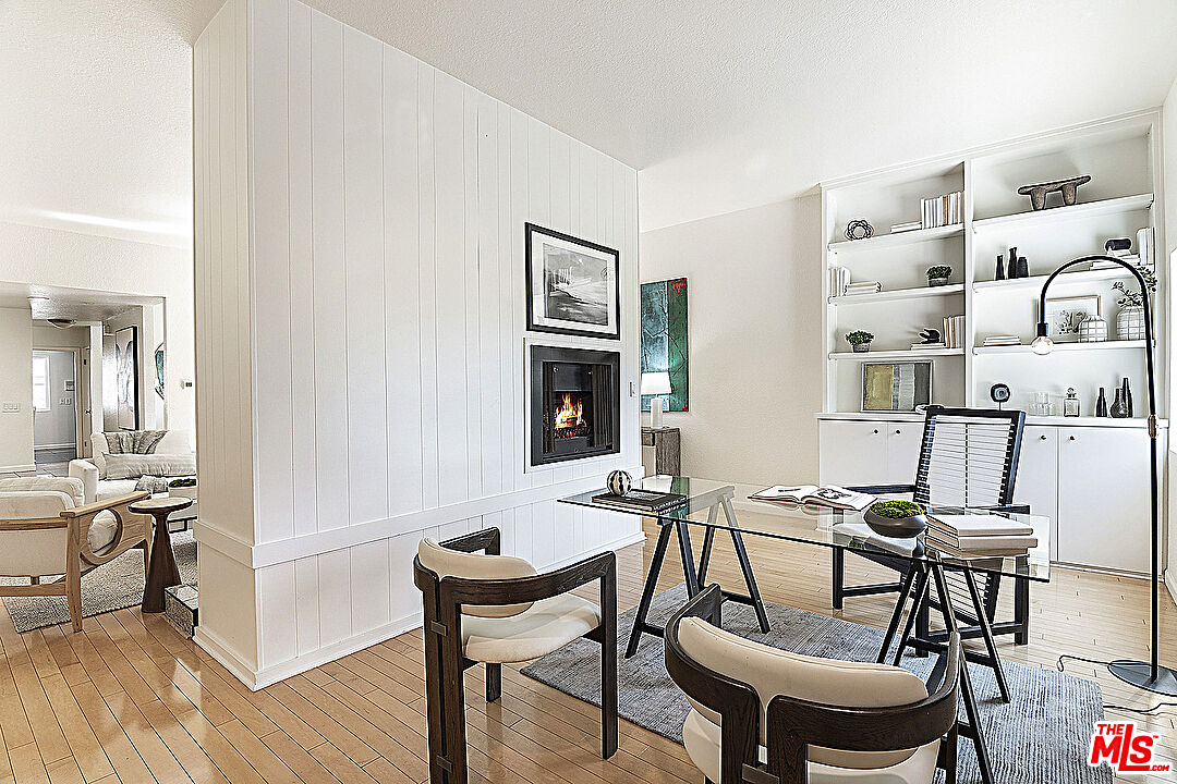 2041 Roscomare Road Los Angeles, CA 90077 - Photo 6 of 28 a view of a dining room with furniture and wooden floor
