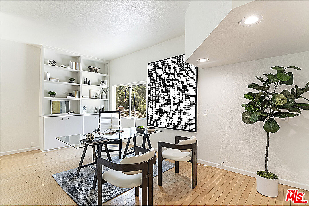 2041 Roscomare Road Los Angeles, CA 90077 - Photo 7 of 28 a table room with furniture and wooden floor