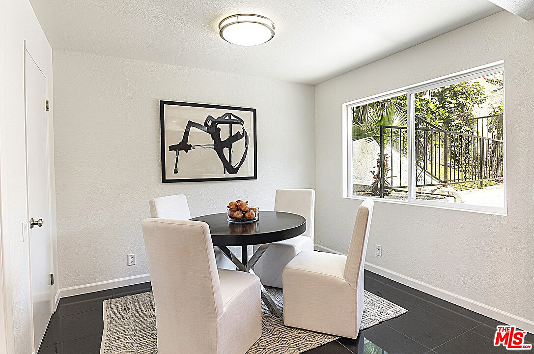 2041 Roscomare Road Los Angeles, CA 90077 - Photo 10 of 28 a view of a dining room with furniture window and outside view