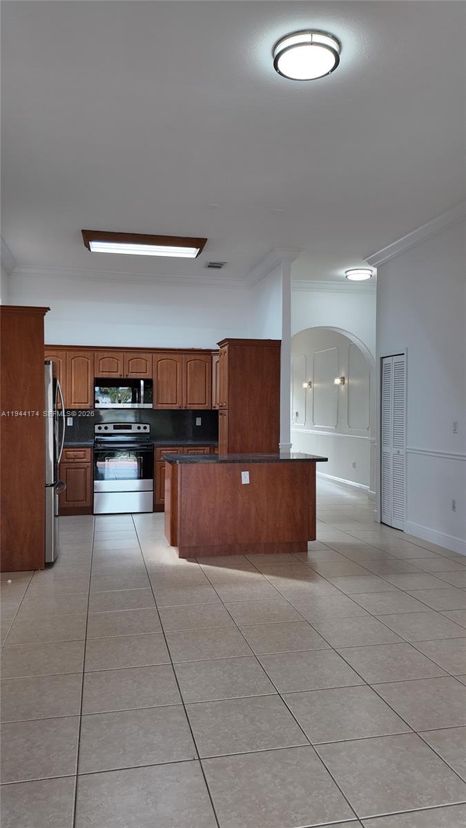 3265 Southwest 153rd Place Miami, FL 33185 - Photo 12 of 39 a view of kitchen with refrigerator and window