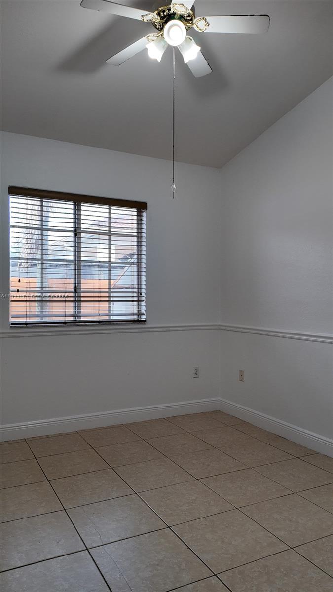 3265 Southwest 153rd Place Miami, FL 33185 - Photo 17 of 39 a view of an empty room with a window