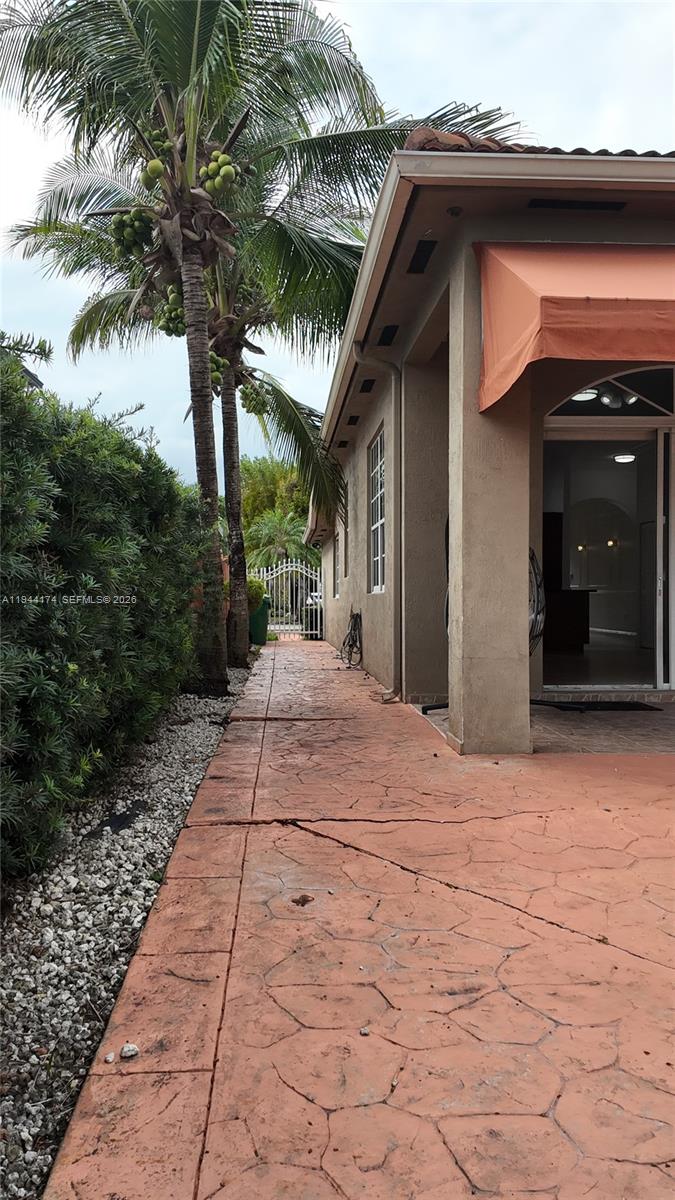 3265 Southwest 153rd Place Miami, FL 33185 - Photo 35 of 39 a front view of a house with a yard