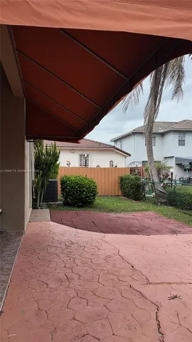 a view of a backyard of a house