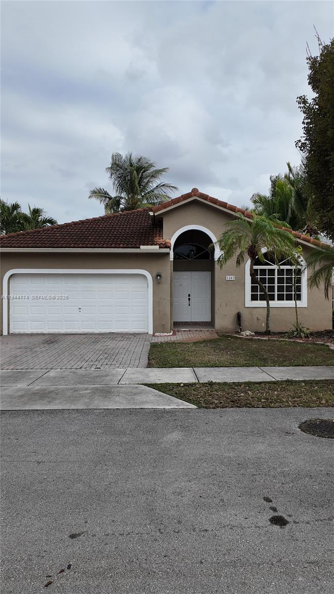 3265 Southwest 153rd Place Miami, FL 33185 - Photo 39 of 39 a front view of a house with a yard