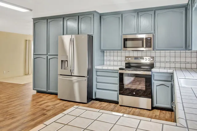 a view of a bathroom with a sink and a mirror