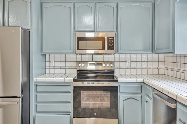 a bathroom with a tub and shower