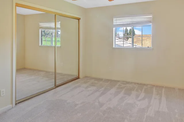 a view of kitchen and hall with wooden floor
