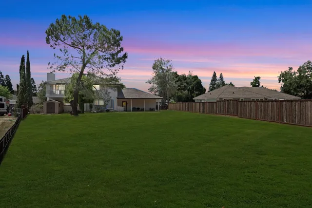a bathroom with a toilet mirror vanity and a sink