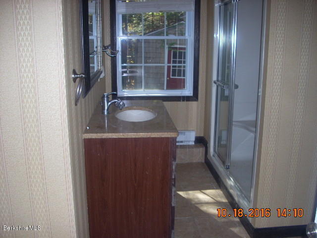 20 West Hubbard Road Sandisfield, MA 01255 - Photo 11 of 15 a bathroom with a sink and mirror