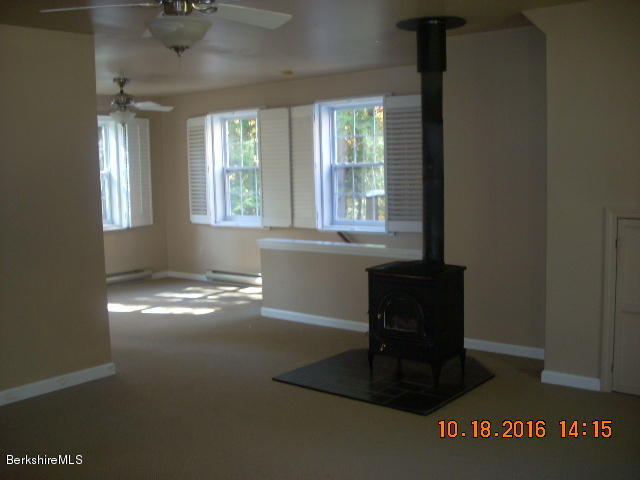20 West Hubbard Road Sandisfield, MA 01255 - Photo 14 of 15 a living room with hard wood floors and a window
