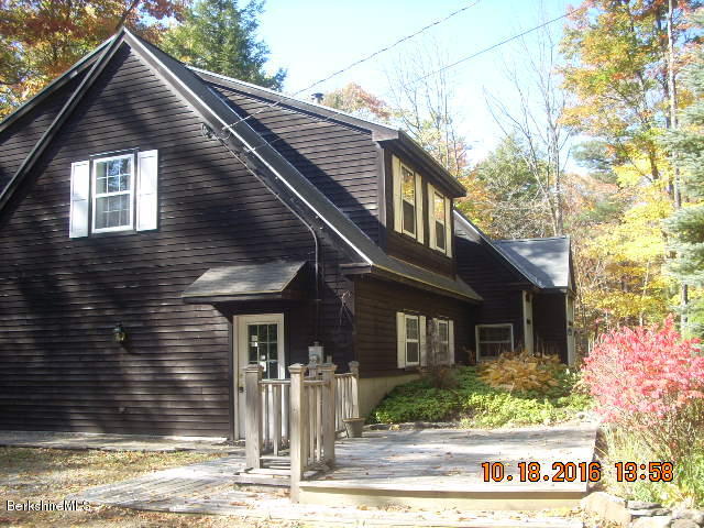 20 West Hubbard Road Sandisfield, MA 01255 - Photo 4 of 15 a front view of a house with a yard