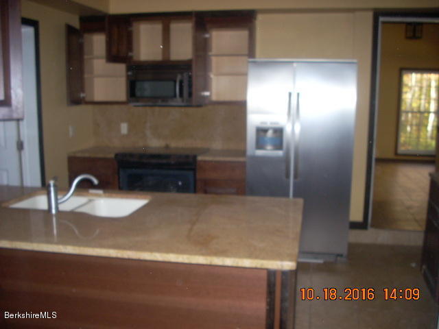 20 West Hubbard Road Sandisfield, MA 01255 - Photo 6 of 15 a kitchen with a sink and a refrigerator
