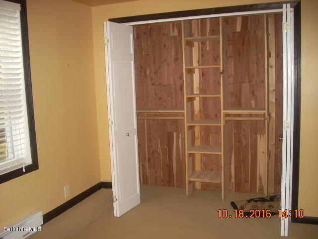 20 West Hubbard Road Sandisfield, MA 01255 - Photo 9 of 15 a view of an empty room with wooden door