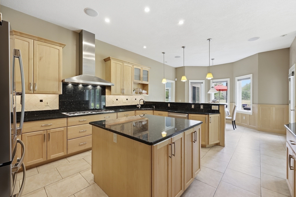33 Labrie Lane Holyoke, MA 01040 - Photo 11 of 42 a kitchen with a sink stove and white cabinets