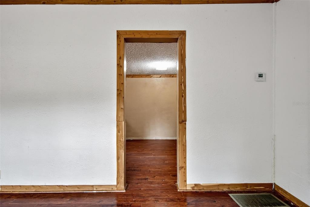 156 Kingfish Road Pomona Park, FL 32181 - Photo 25 of 55 a view of empty room with wooden floor