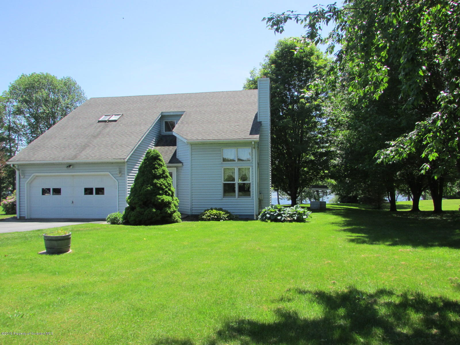 1315 Old County Road Montrose, PA 18801 - Photo 2 of 74 a view of a house with a yard and sitting area