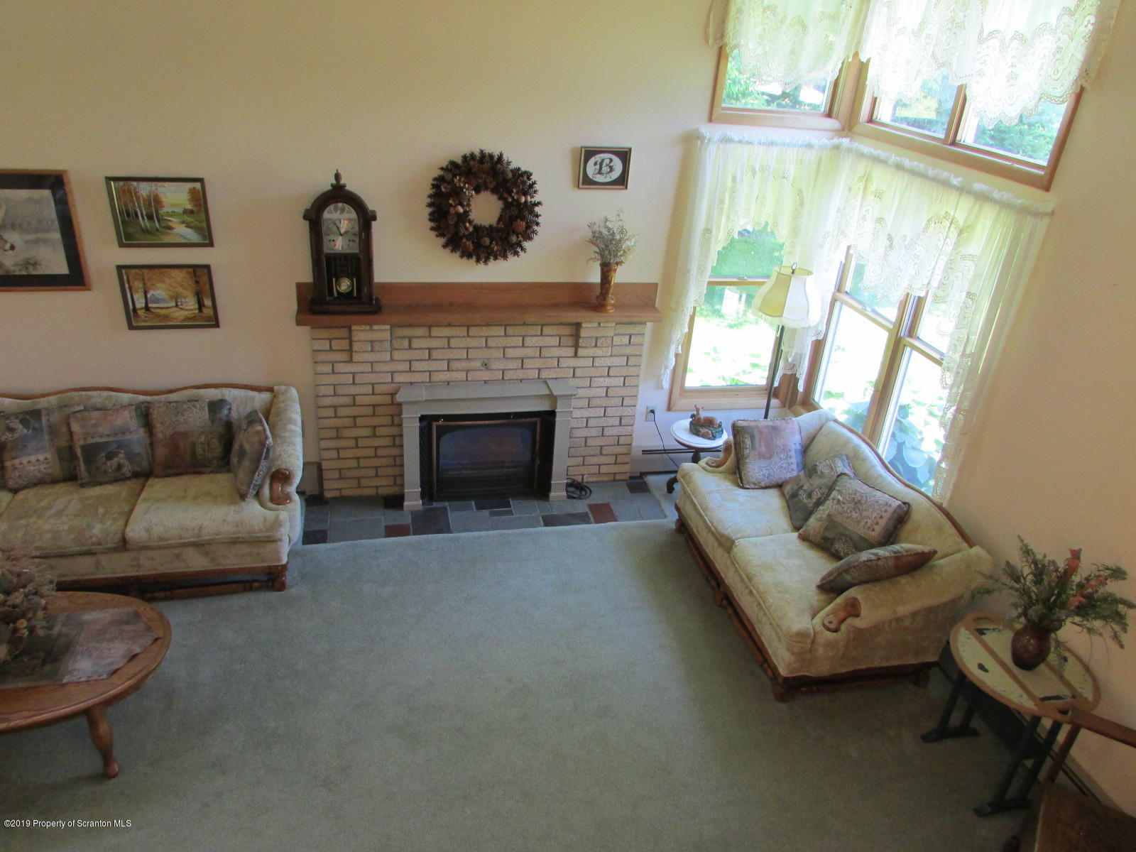 1315 Old County Road Montrose, PA 18801 - Photo 22 of 74 a living room with furniture and a fireplace