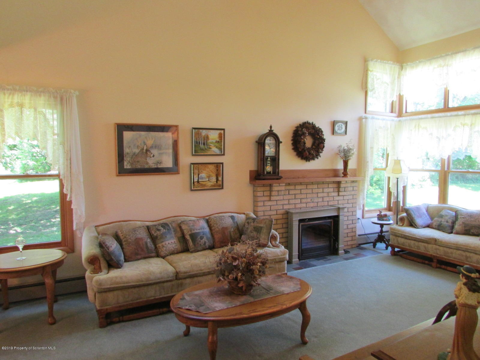 1315 Old County Road Montrose, PA 18801 - Photo 23 of 74 a living room with furniture and a fireplace