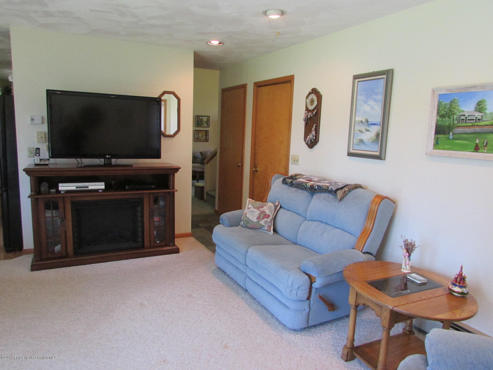 1315 Old County Road Montrose, PA 18801 - Photo 29 of 74 a living room with furniture and a flat screen tv