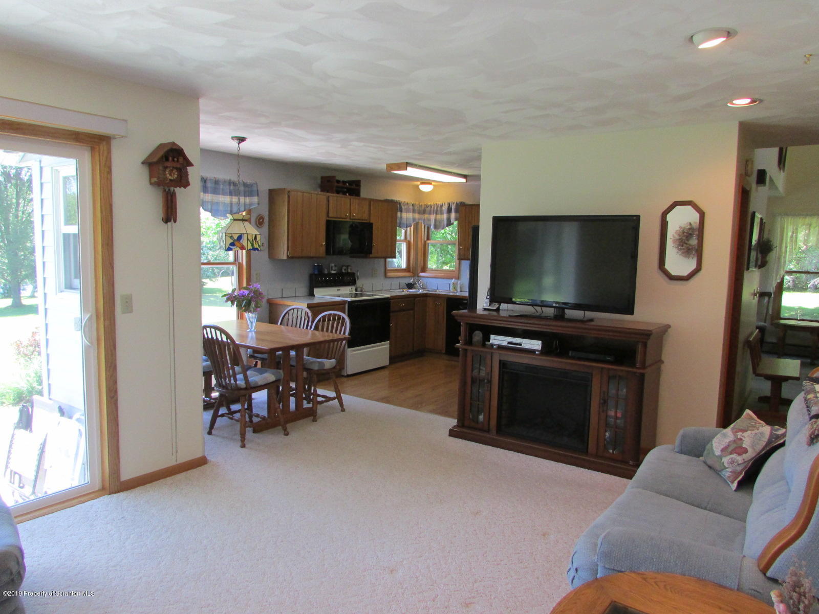 1315 Old County Road Montrose, PA 18801 - Photo 30 of 74 a living room with furniture and a flat screen tv