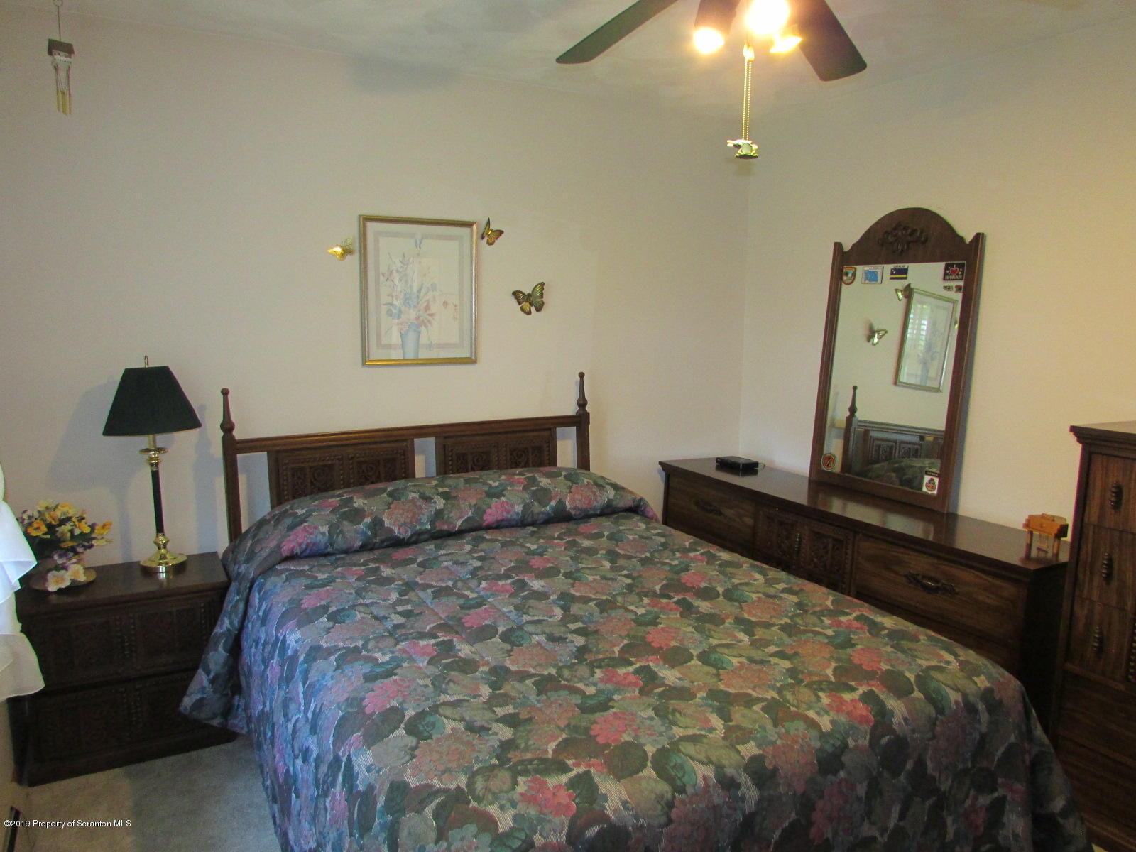 1315 Old County Road Montrose, PA 18801 - Photo 33 of 74 a bedroom with a bed and a mirror on dresser