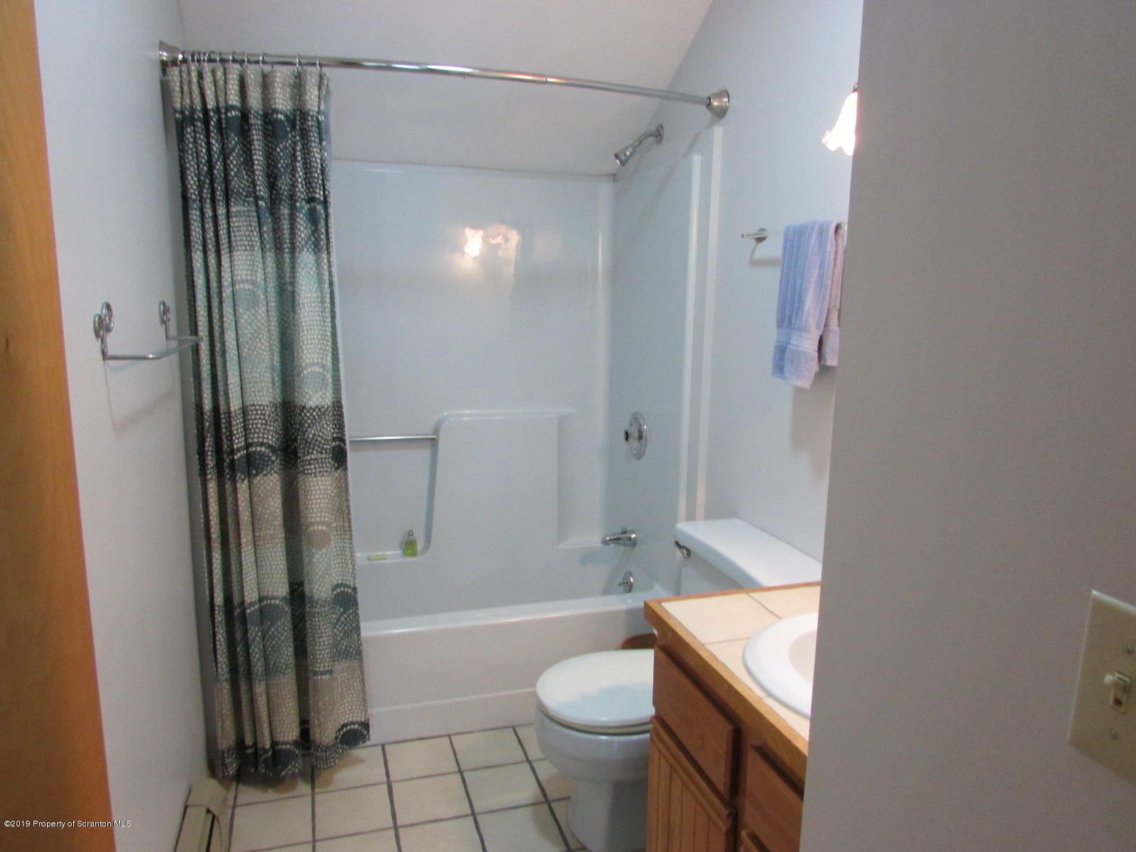 1315 Old County Road Montrose, PA 18801 - Photo 35 of 74 a bathroom with a sink a toilet and shower