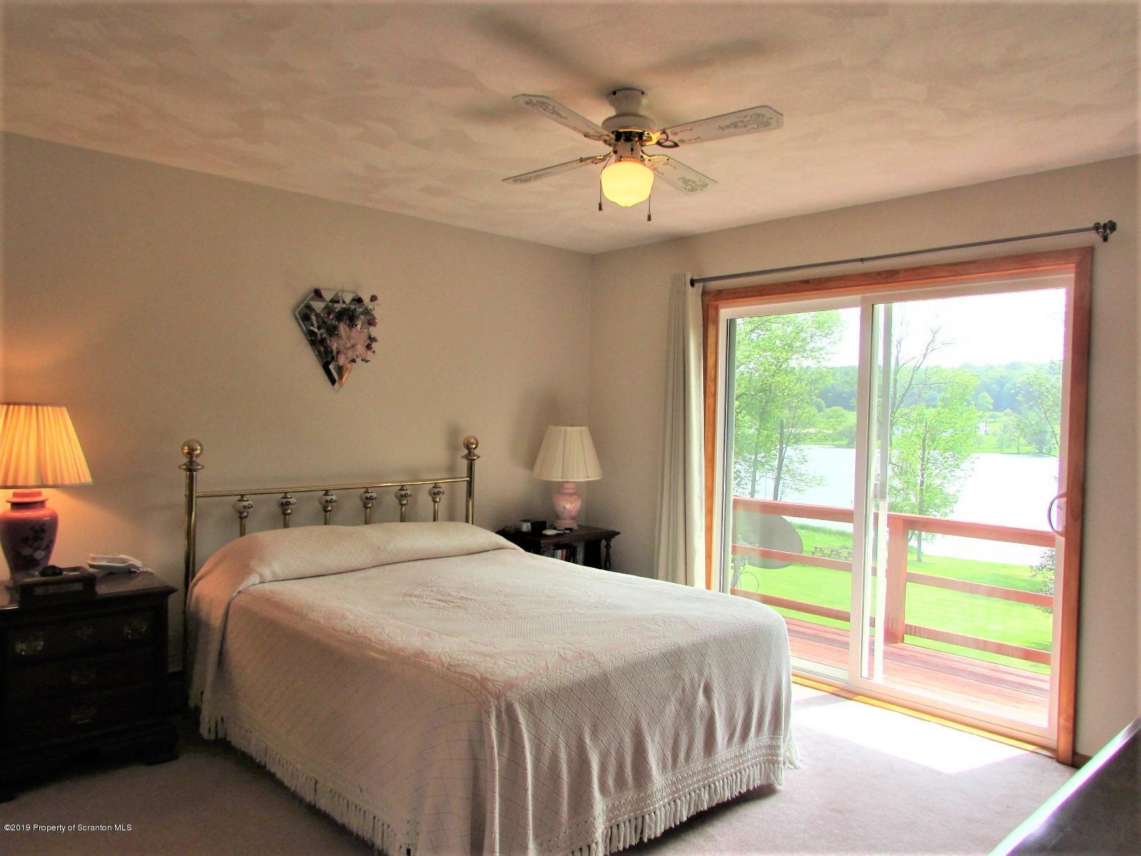 1315 Old County Road Montrose, PA 18801 - Photo 37 of 74 a bedroom with a bed and a window