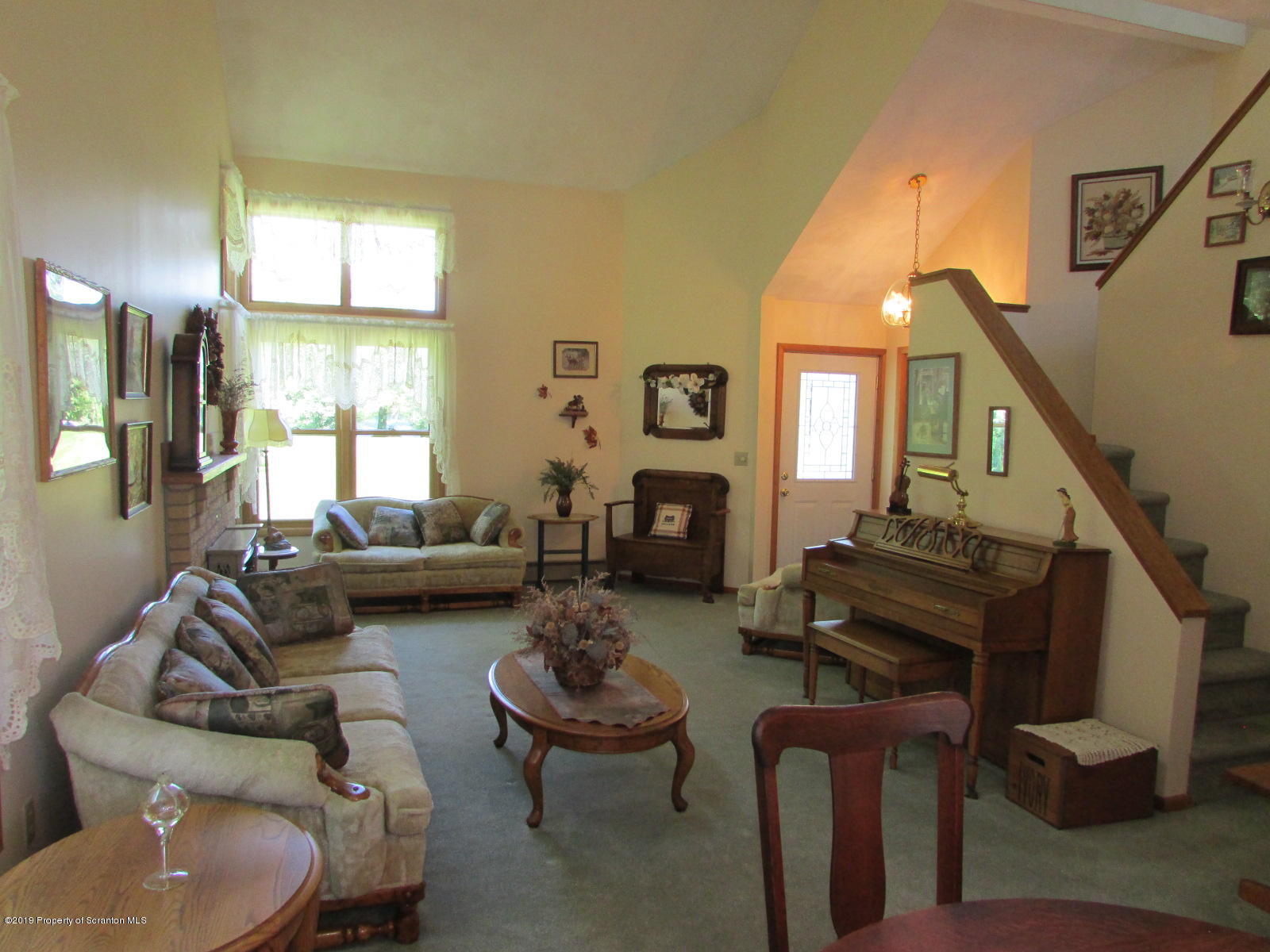 1315 Old County Road Montrose, PA 18801 - Photo 4 of 74 a living room with furniture fireplace and a window