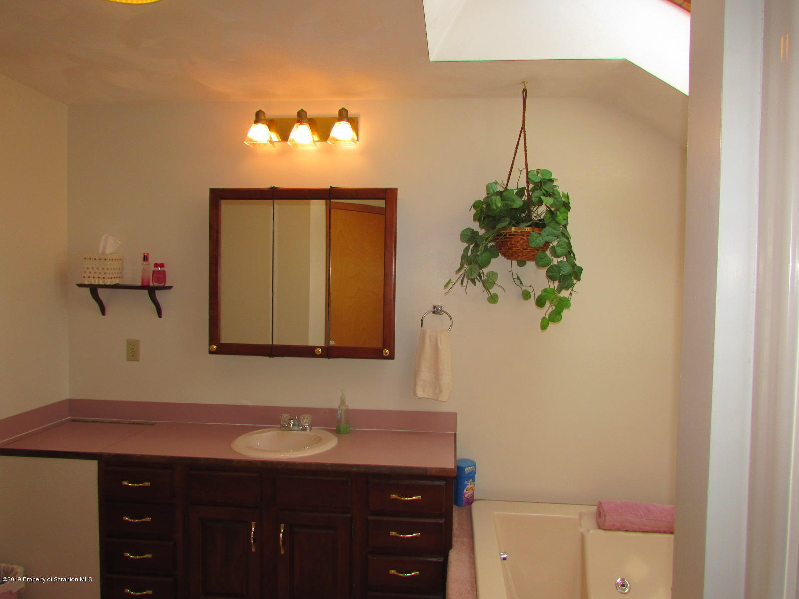 1315 Old County Road Montrose, PA 18801 - Photo 43 of 74 a bathroom with a sink vanity and a mirror