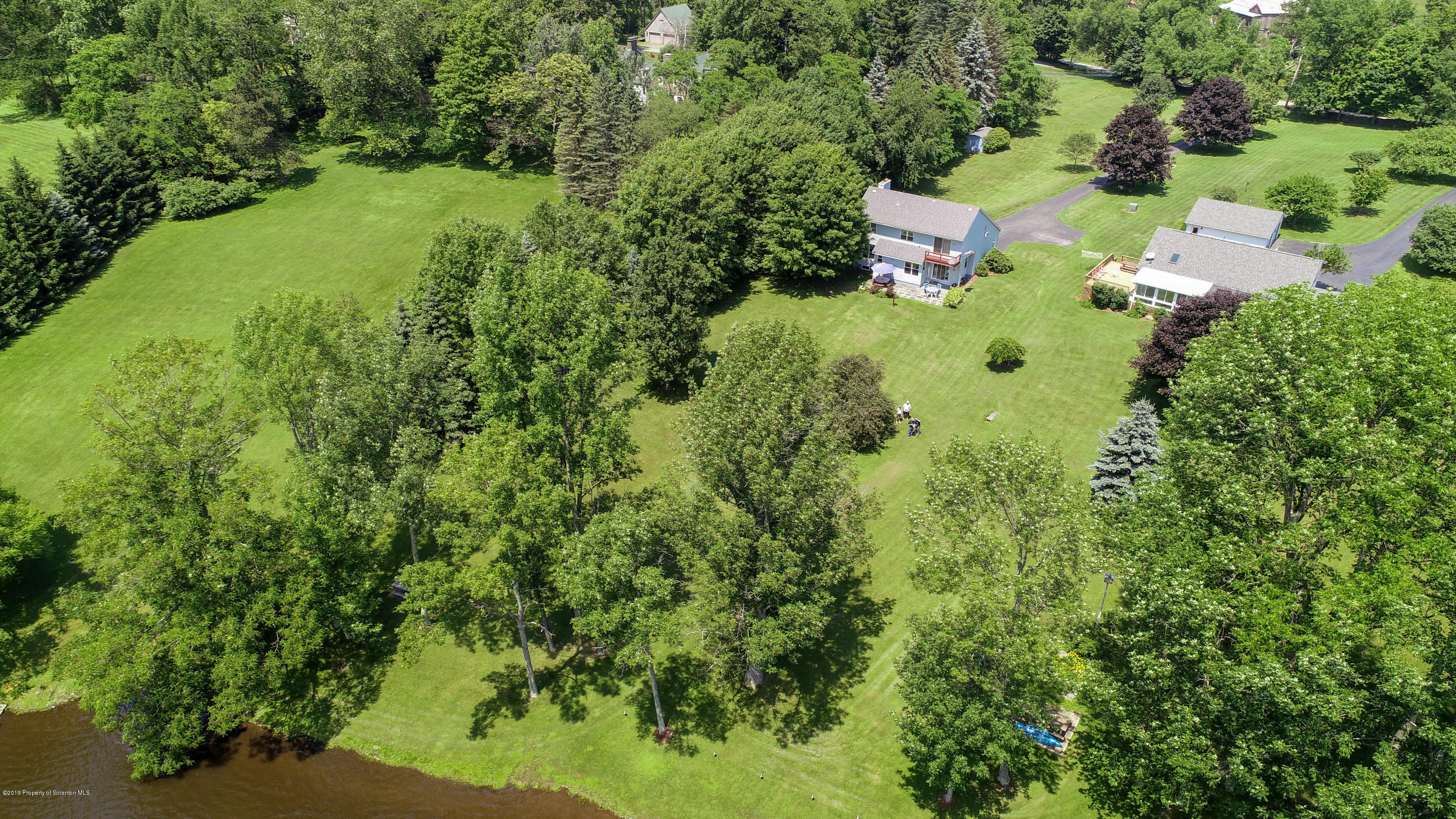 1315 Old County Road Montrose, PA 18801 - Photo 70 of 74 an aerial view of a house with pool yard outdoor seating and yard