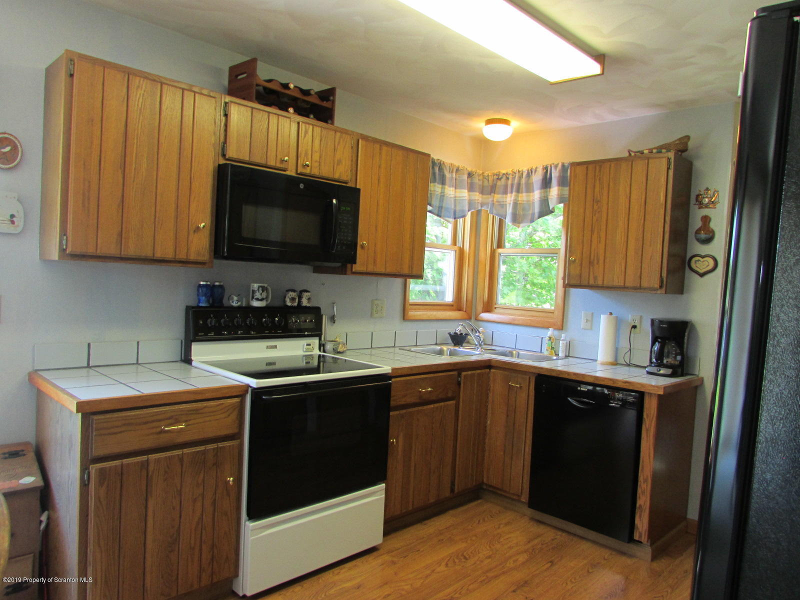 1315 Old County Road Montrose, PA 18801 - Photo 9 of 74 a kitchen with a sink stove and microwave