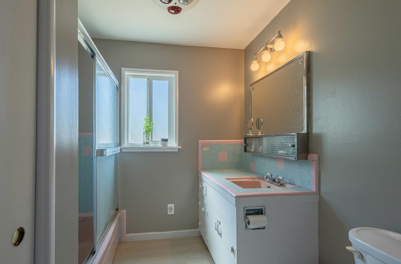 454 Paradise Road Salinas, CA 93907 - Photo 22 of 31 a bathroom with a sink and a mirror