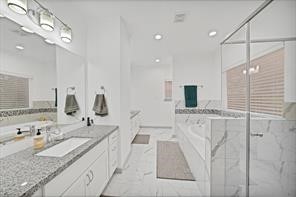 907 Frio Street Houston, TX 77012 - Photo 19 of 23 a bathroom with a granite countertop double vanity sink and mirror