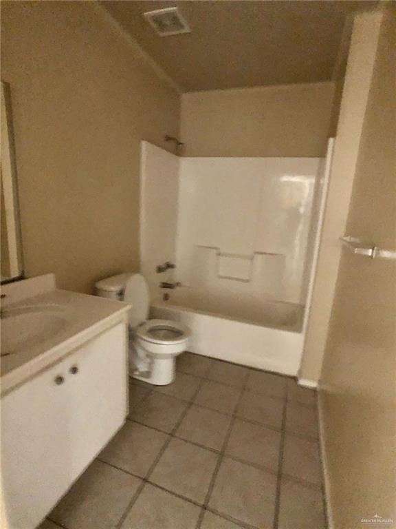 2508 East U.S. Business 83, Unit 27 Mission, TX 78572 - Photo 11 of 14 a bathroom with a granite countertop sink a toilet and shower