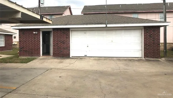a kitchen with stainless steel appliances a white counter top and white cabinets