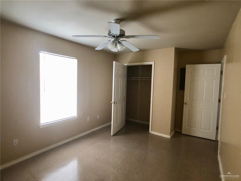 2508 East U.S. Business 83, Unit 27 Mission, TX 78572 - Photo 10 of 14 an empty room with windows and fan