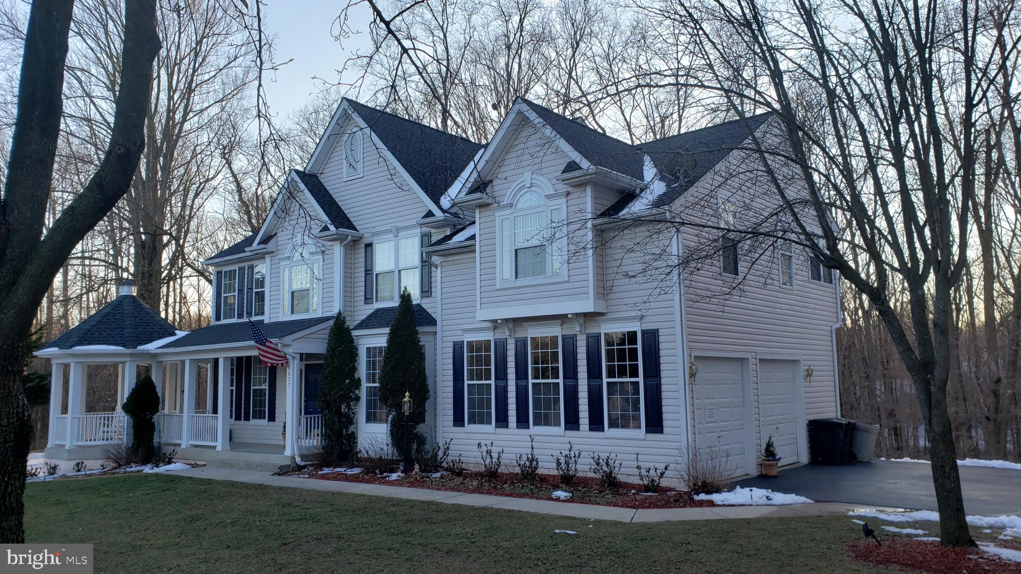 8637 Willow Run Road Baltimore, MD 21244 - Photo 1 of 56 a front view of a house with a yard