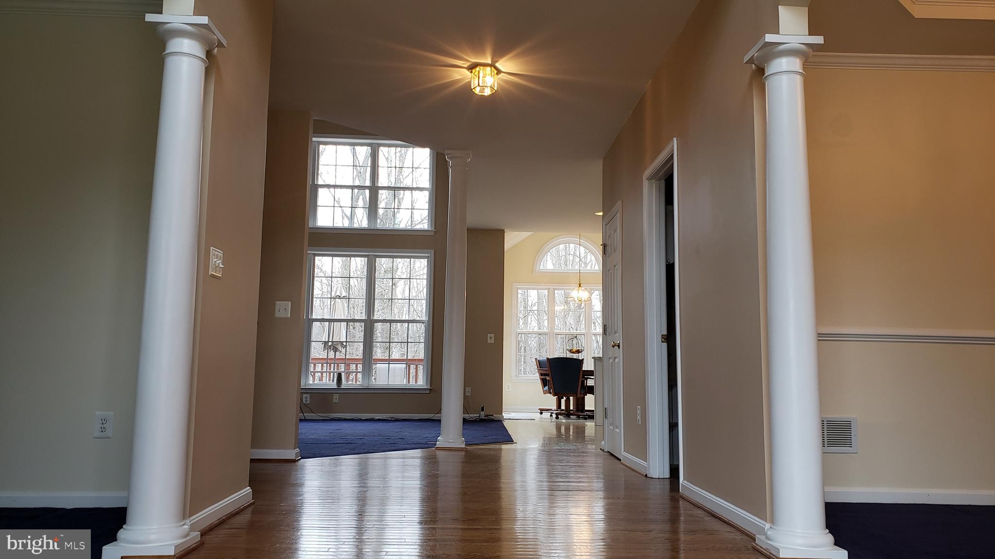 8637 Willow Run Road Baltimore, MD 21244 - Photo 13 of 56 a view of an entryway with wooden floor
