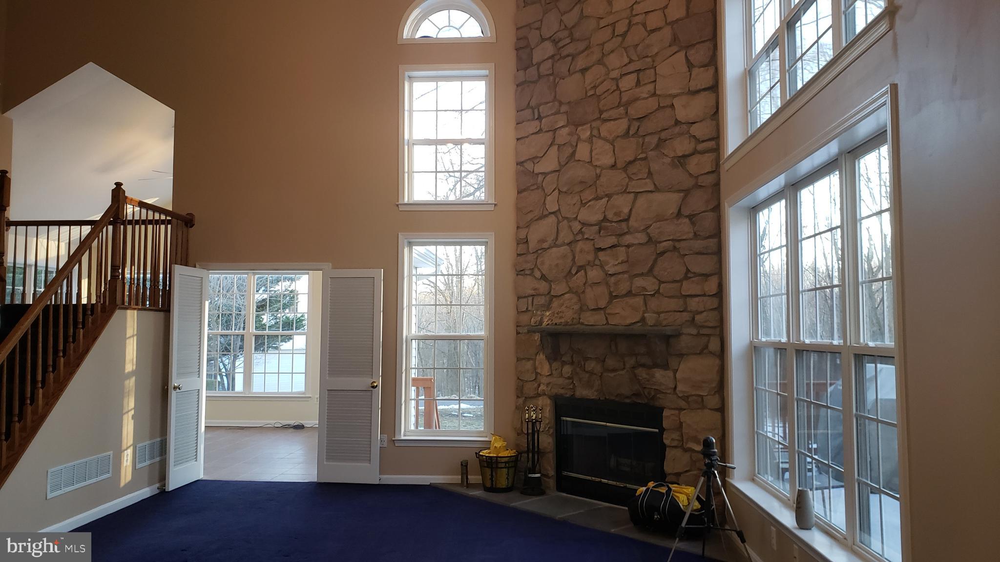8637 Willow Run Road Baltimore, MD 21244 - Photo 16 of 56 a living room with furniture and a fireplace