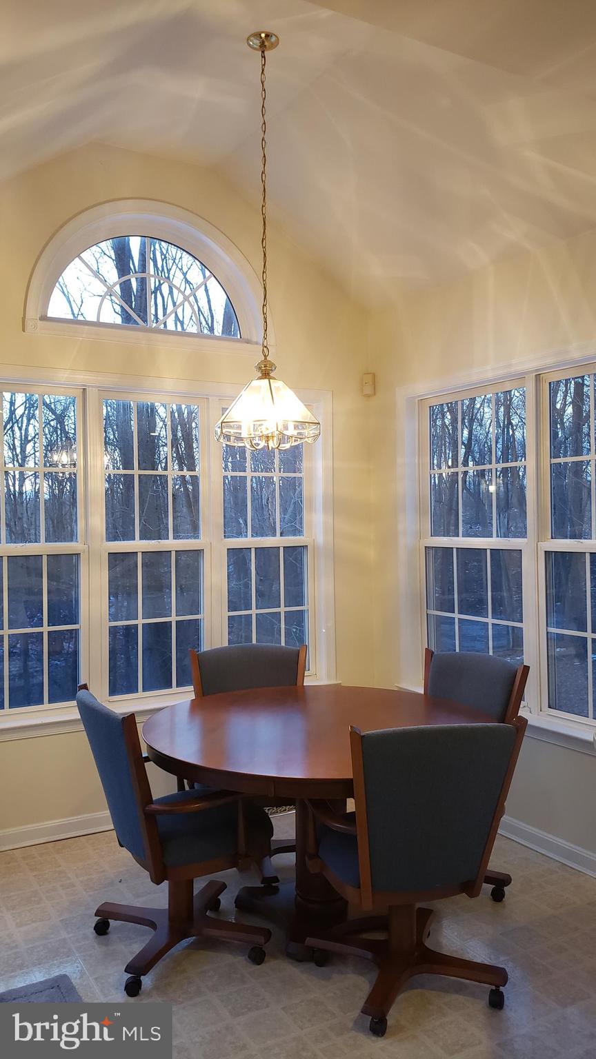8637 Willow Run Road Baltimore, MD 21244 - Photo 23 of 56 a view of a workspace with furniture and a window