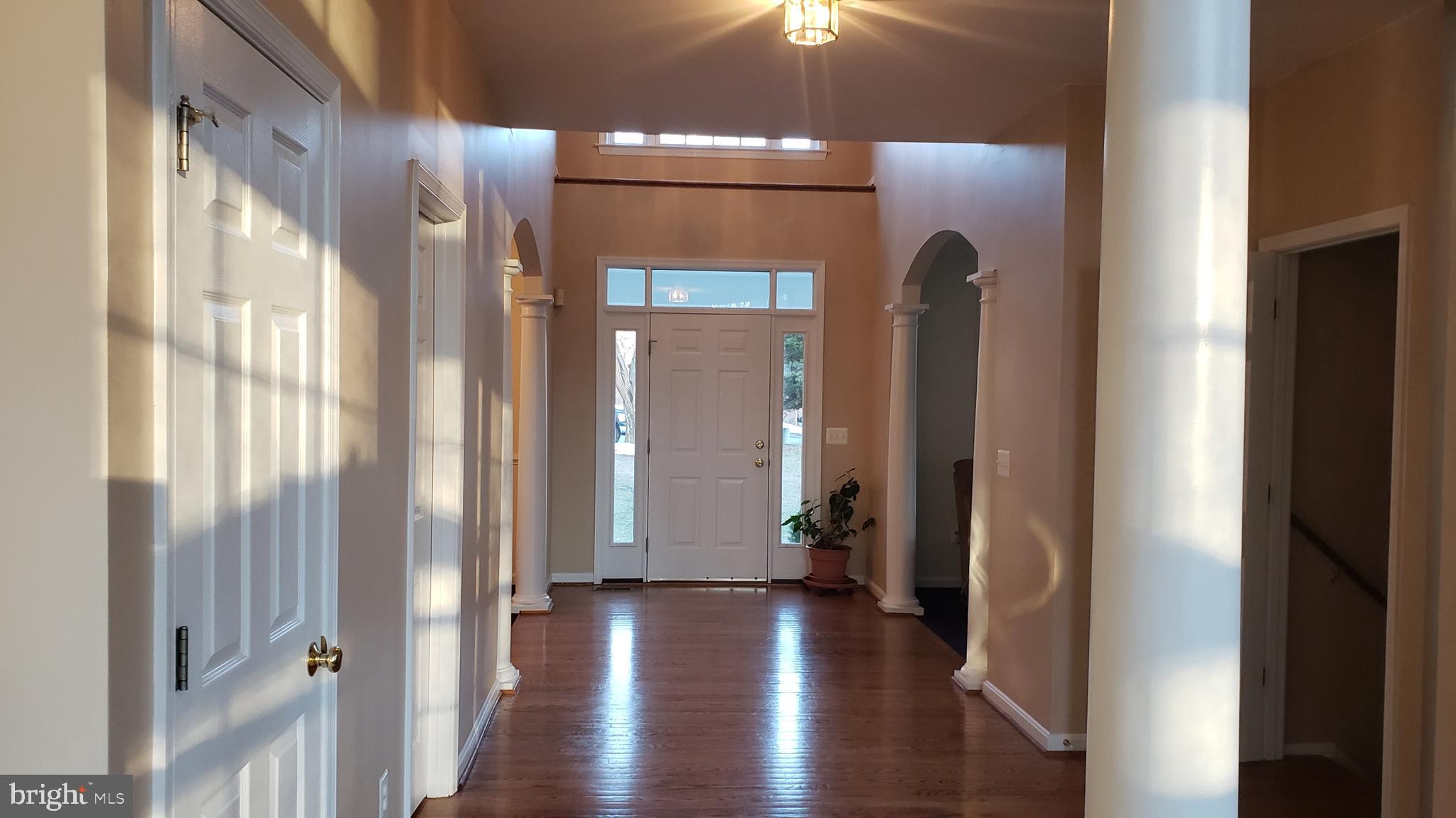 8637 Willow Run Road Baltimore, MD 21244 - Photo 24 of 56 a view of a hallway with wooden floor