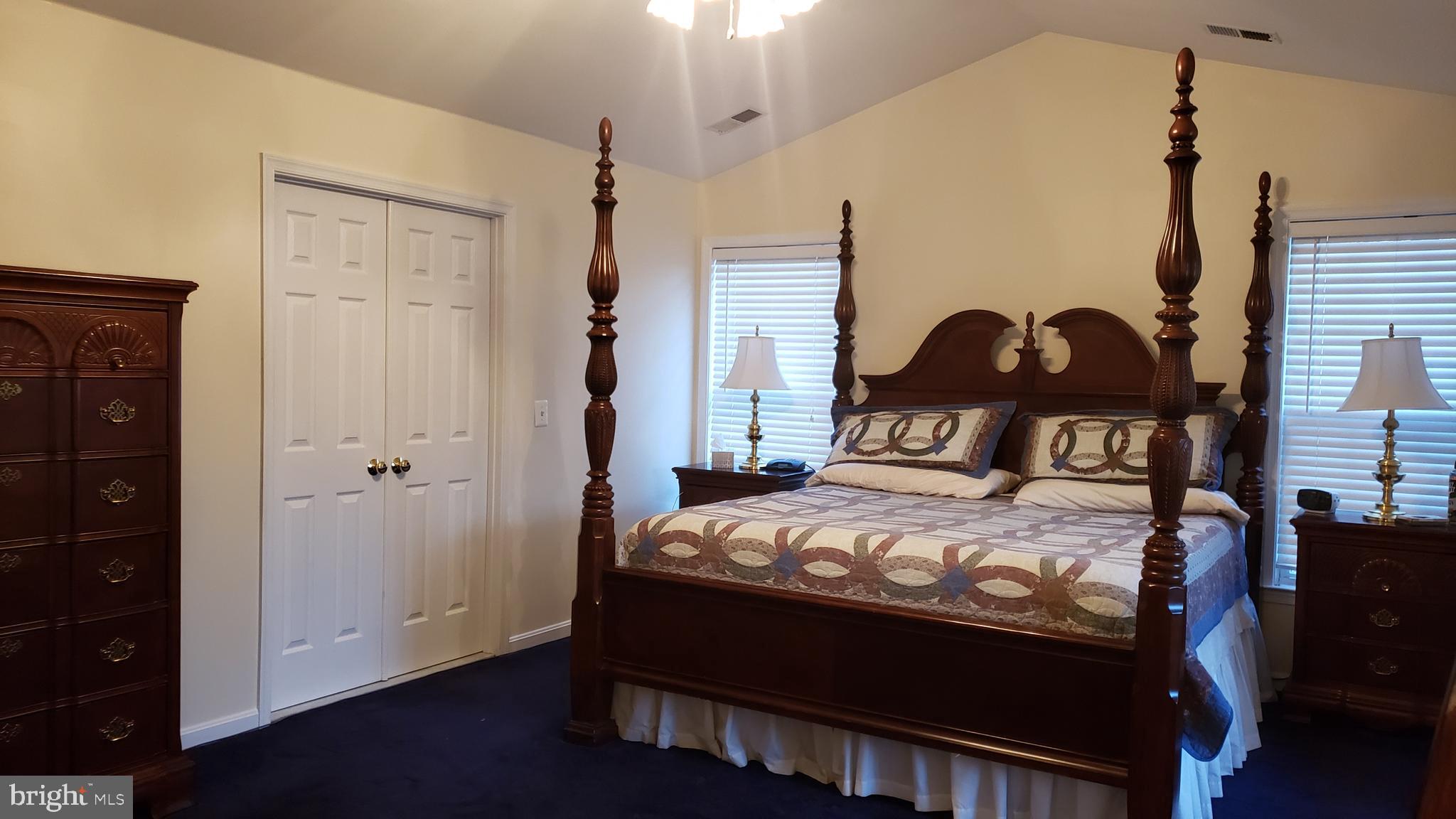 8637 Willow Run Road Baltimore, MD 21244 - Photo 32 of 56 a bedroom with a bed and a window